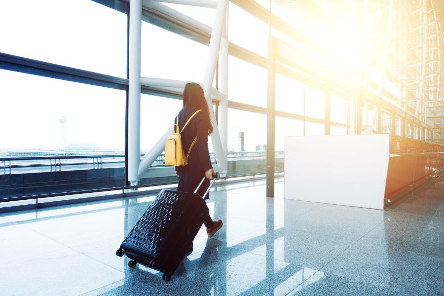 lady with a box in an airport